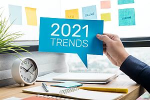 Person holding 2021 trends sign 