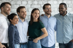 group of workers happy with their employer because of level funding