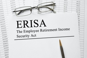 paper and pencil explaining what is considered an ERISA plan