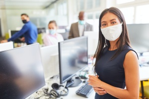 women at work wearing her mask
