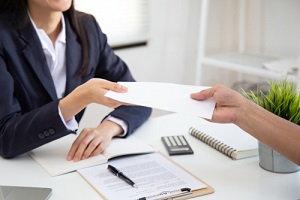 young asian business woman receiving executive bonus plans from boss