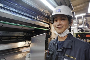 a manufacturing company worker smiling