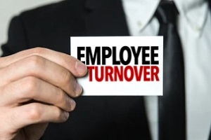 man holding employee turnover card