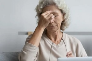 women with stressed eyes learning about Employee Benefits Guide