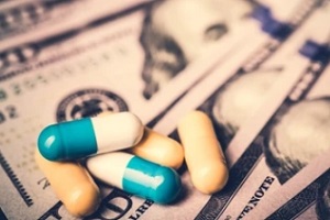 medicine capsules on the dollars