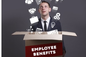businessman opening box with employee benefits