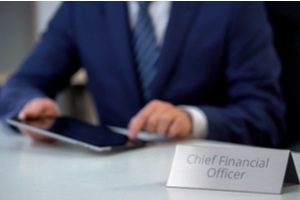 chief financial officer planning company budget on tablet pc