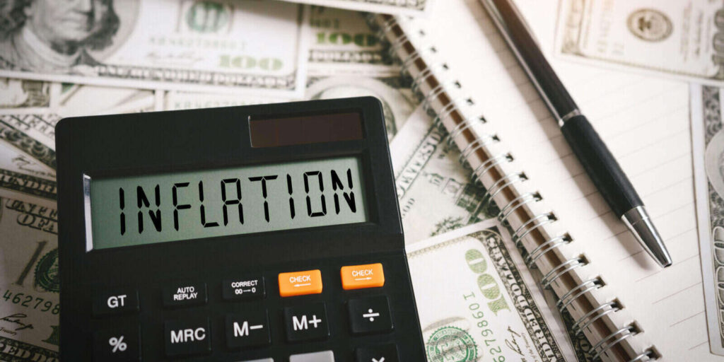inflation word on calculator in idea for fed consider interest rate hike