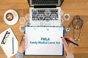 family medical leave act on clibaord with macbook